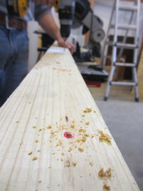 Drilling holes.