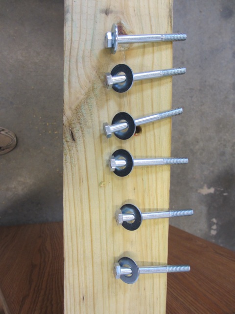 The screws that will hold up the sill plate against the chassis.