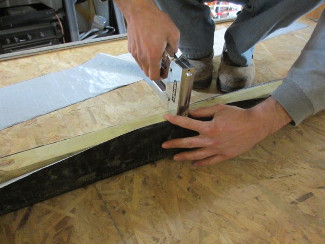 Because the sill plates are going to be up against metal, we wrapped all of them to protect them from potential rust and rot. The underbelly wrap is stapled to the sill plates.
