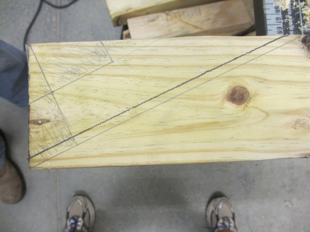  Jerud measured and marked 2x4s that will be the bottom front of our bedroom. 