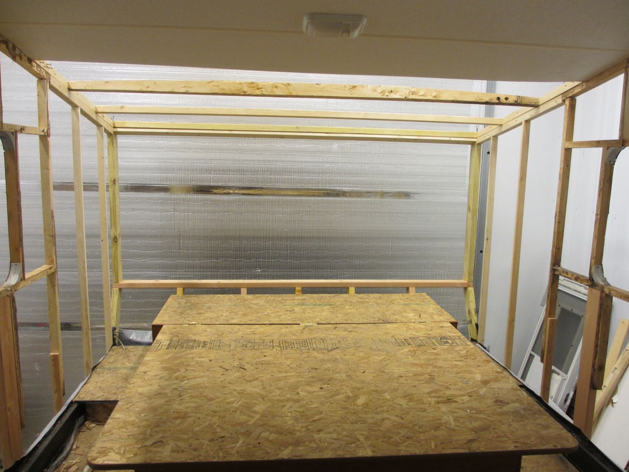 This is what the bedroom looked like once the roof studs were installed and the side wall luan removed. 