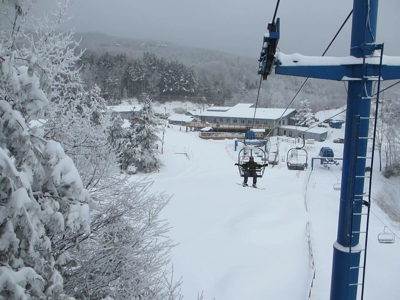 That's the ski lodge in the background. No hotels, no condos, nothing but that and some lifts. Simple.