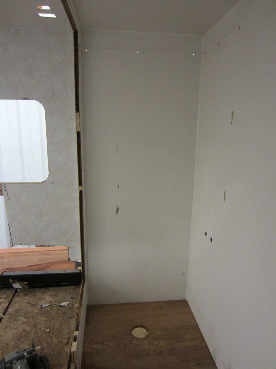 The wall in the previous picture used to be here, to the right of the window, separating the bedroom from the shower.