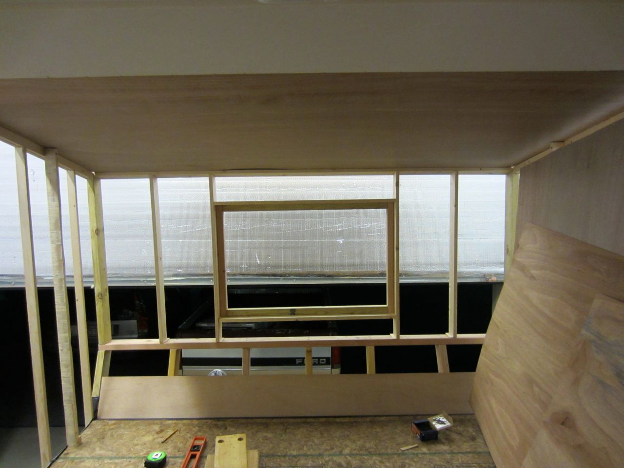 Window frame mounted into the front bedroom walls after we screwed in the front bedroom studs.