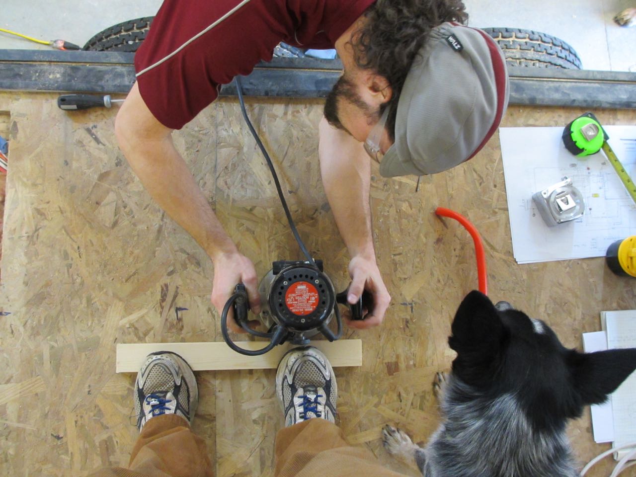 Using a guide to create a shallow channel for the heater wires to lay across the floor without getting crushed.