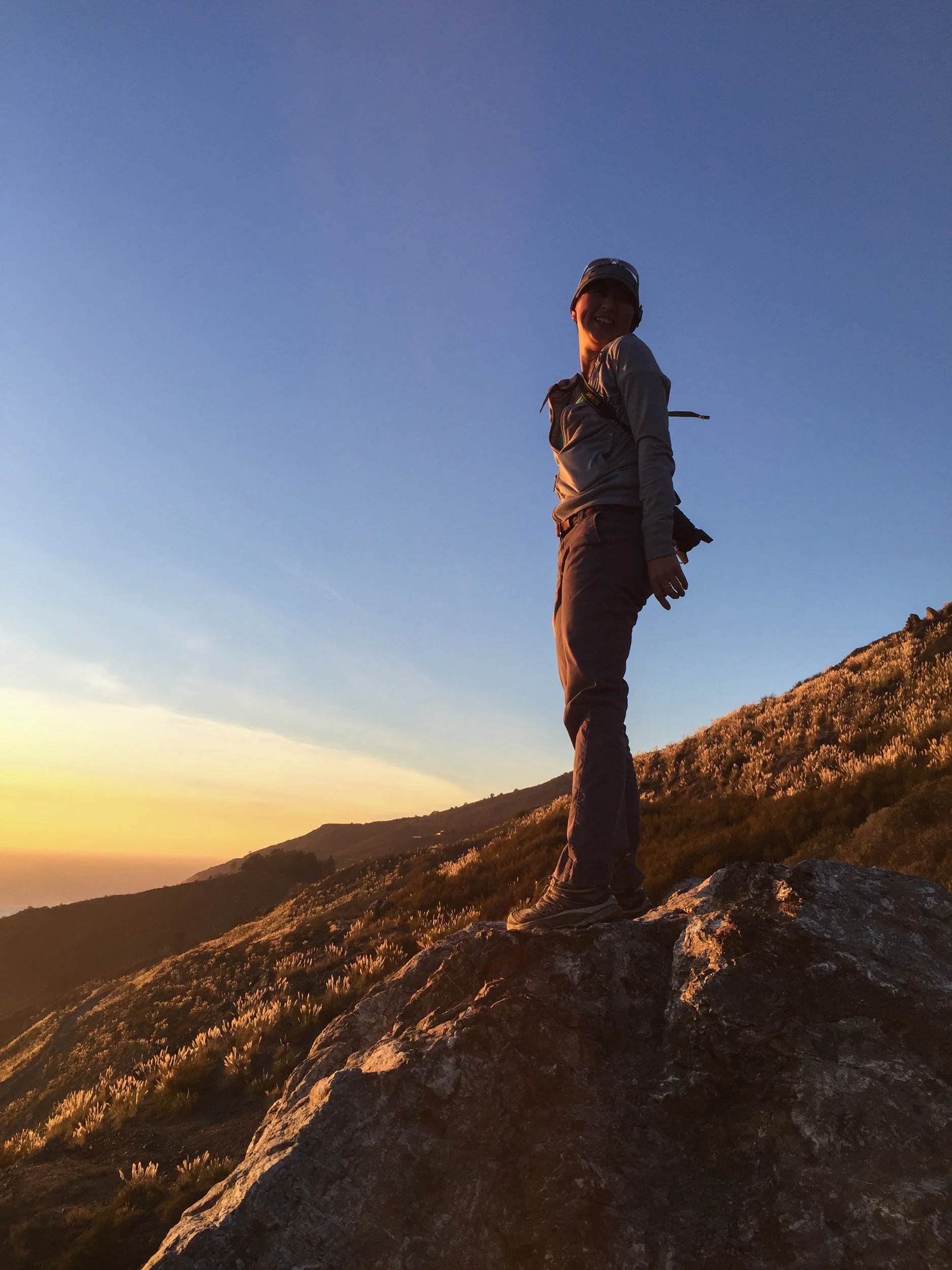 Ching standing at the top of the hill.