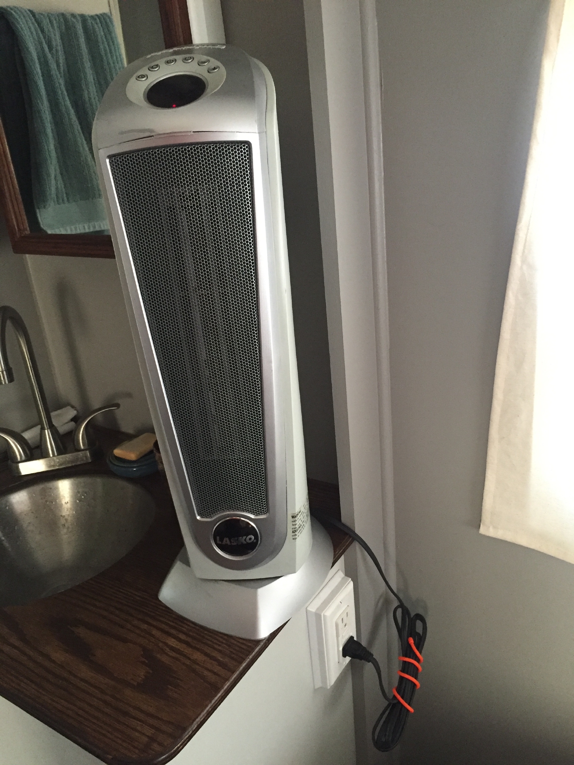 Space heater in its usual home on the bathroom counter