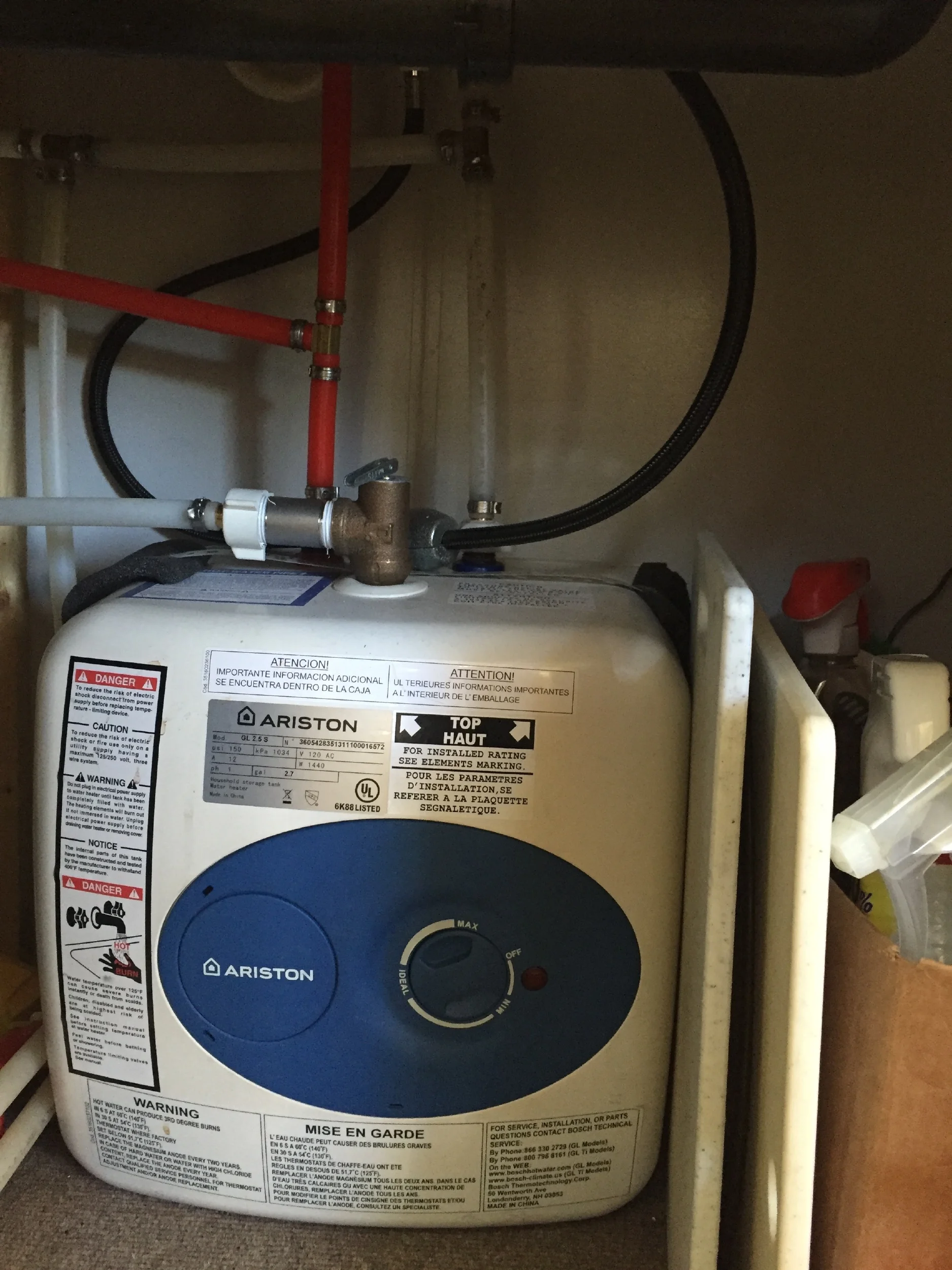 The kitchen water heater. The trash can typically lives in front of it.