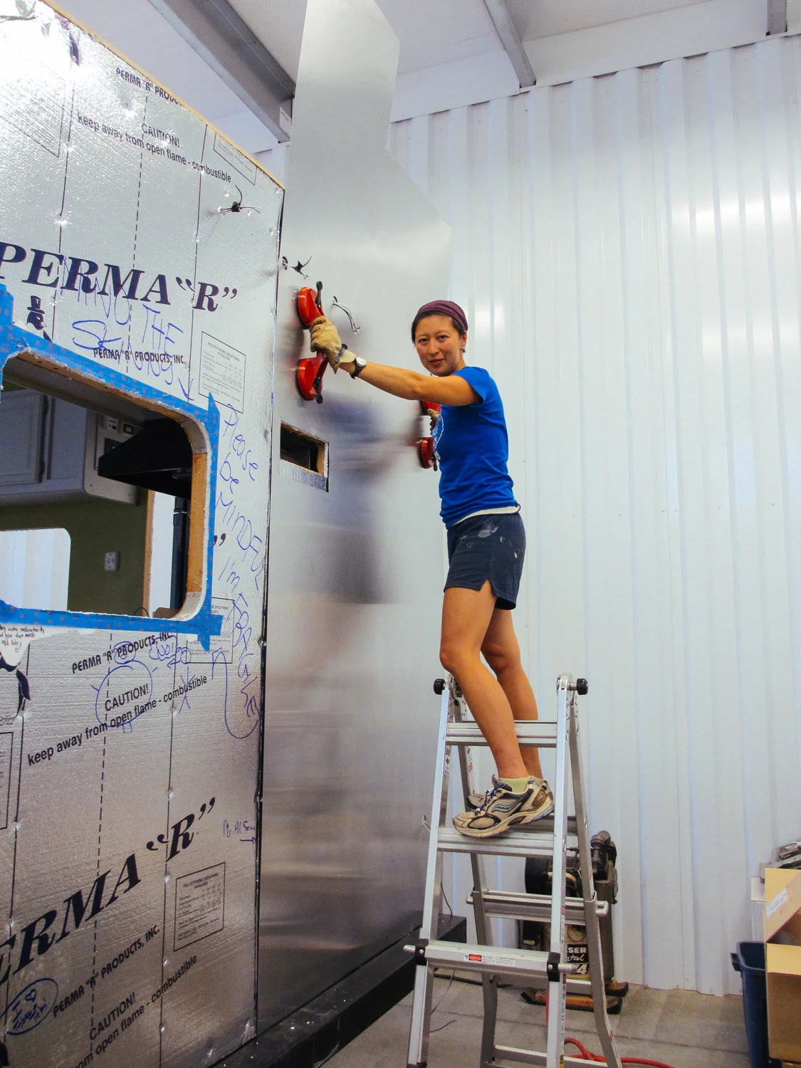 We used heavy duty suction cups to move and hang the aluminum sheets.