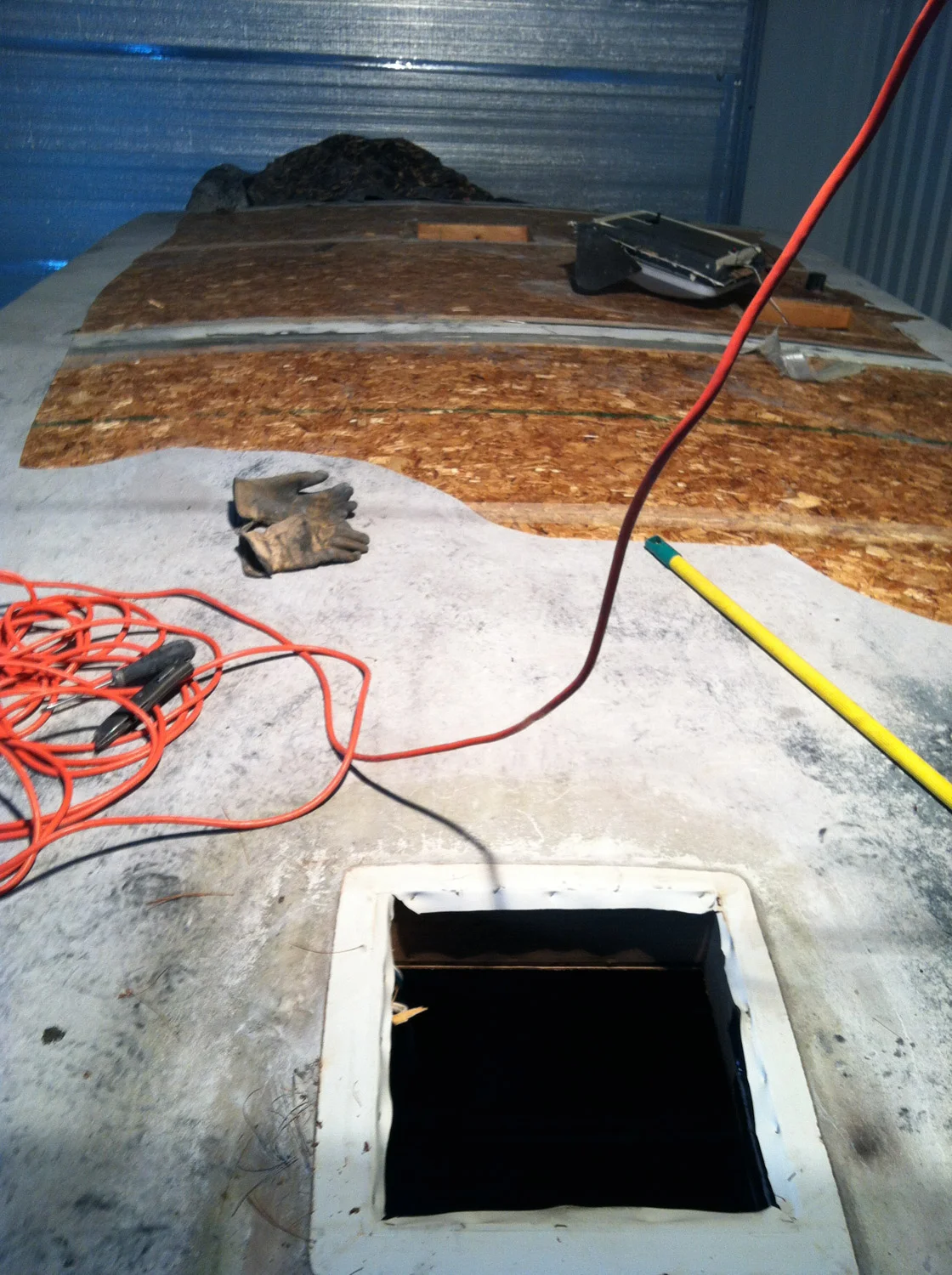Ripping off the old rubber roof off was a major pain in the ass. It was still tightly glued to the decking.