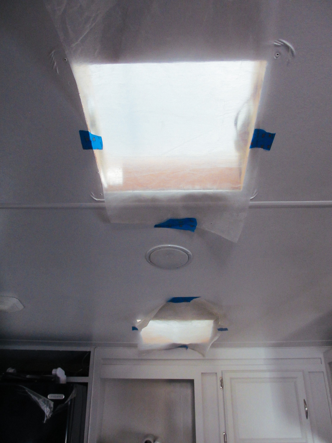  We covered the inside of the vent holes with plastic to prevent roof adhesive dripping into the rig. 