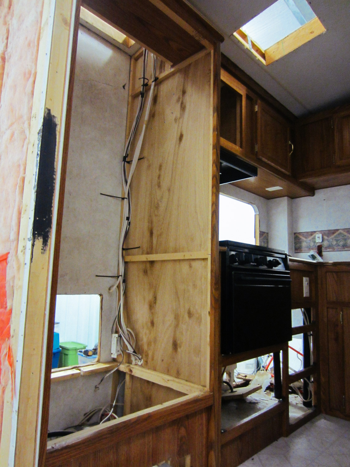  Since we were going to put in a residential fridge, we removed original cabinetry that held the RV fridge. 