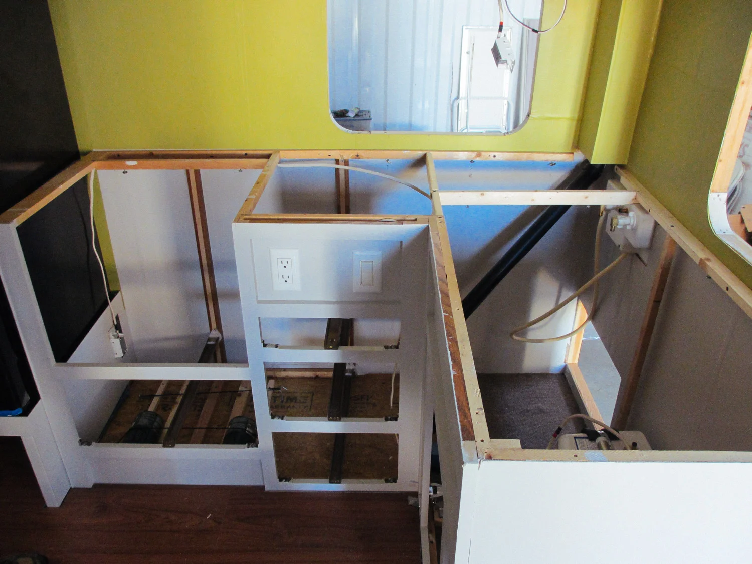 The main kitchen cabinets were reinstalled after being painted.
