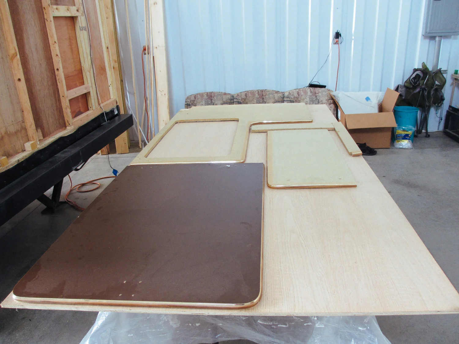 We traced the original kitchen countertop and flip-up on oak plywood to make new countertops.