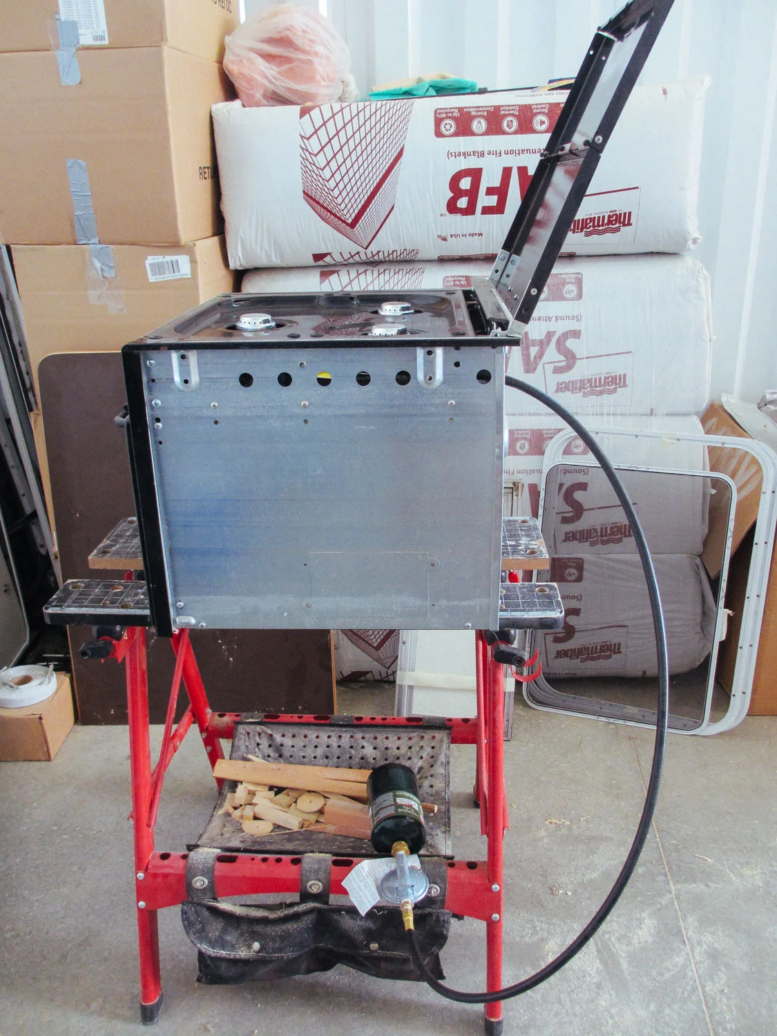 Since the RV stove/oven was our only propane appliance, we wanted to run it off camping propane fuel bottles instead of traditional RV propane tanks.