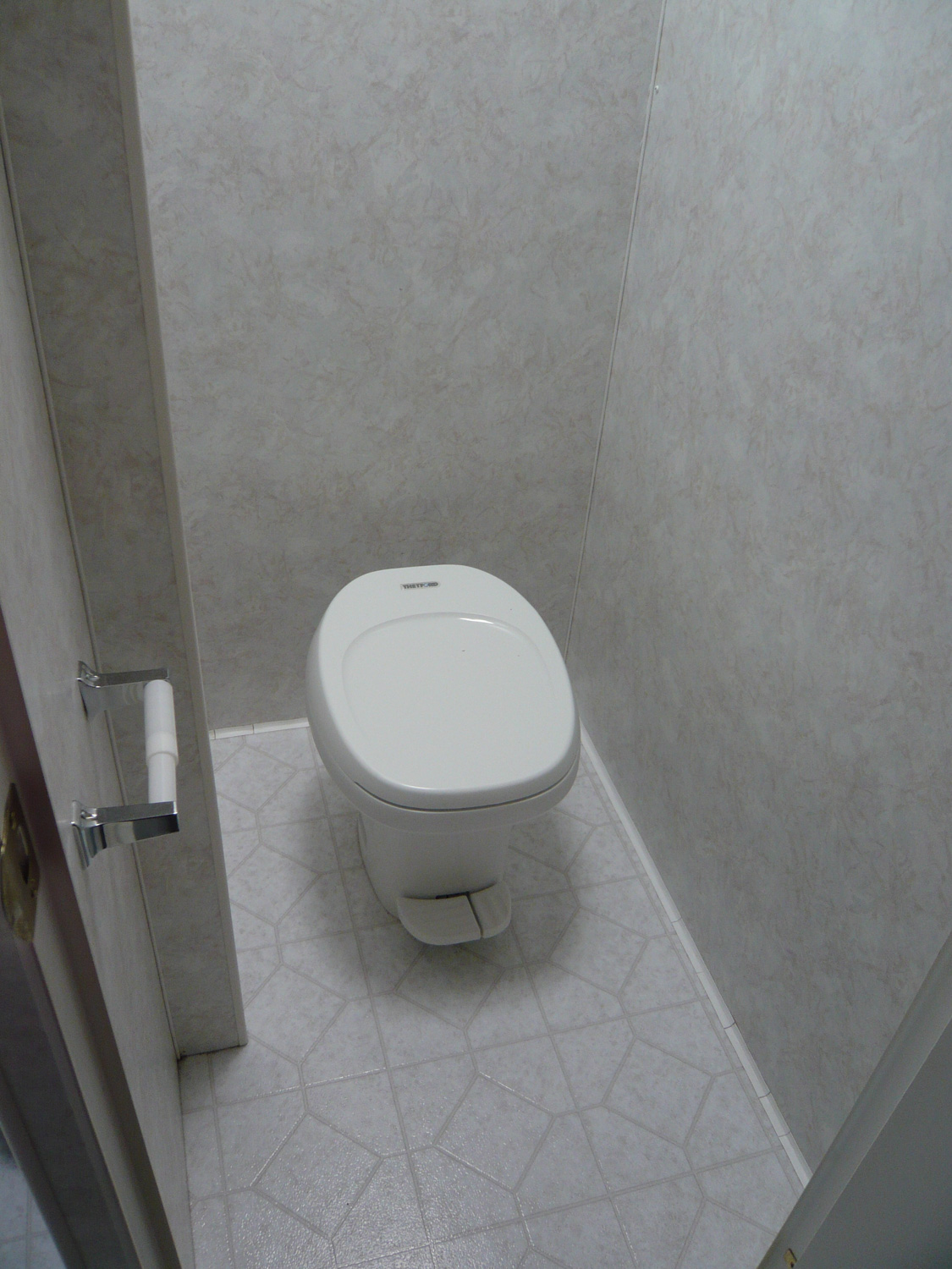  This was how the toilet room originally looked. It sits to the left of the shower, separated by a wall. 