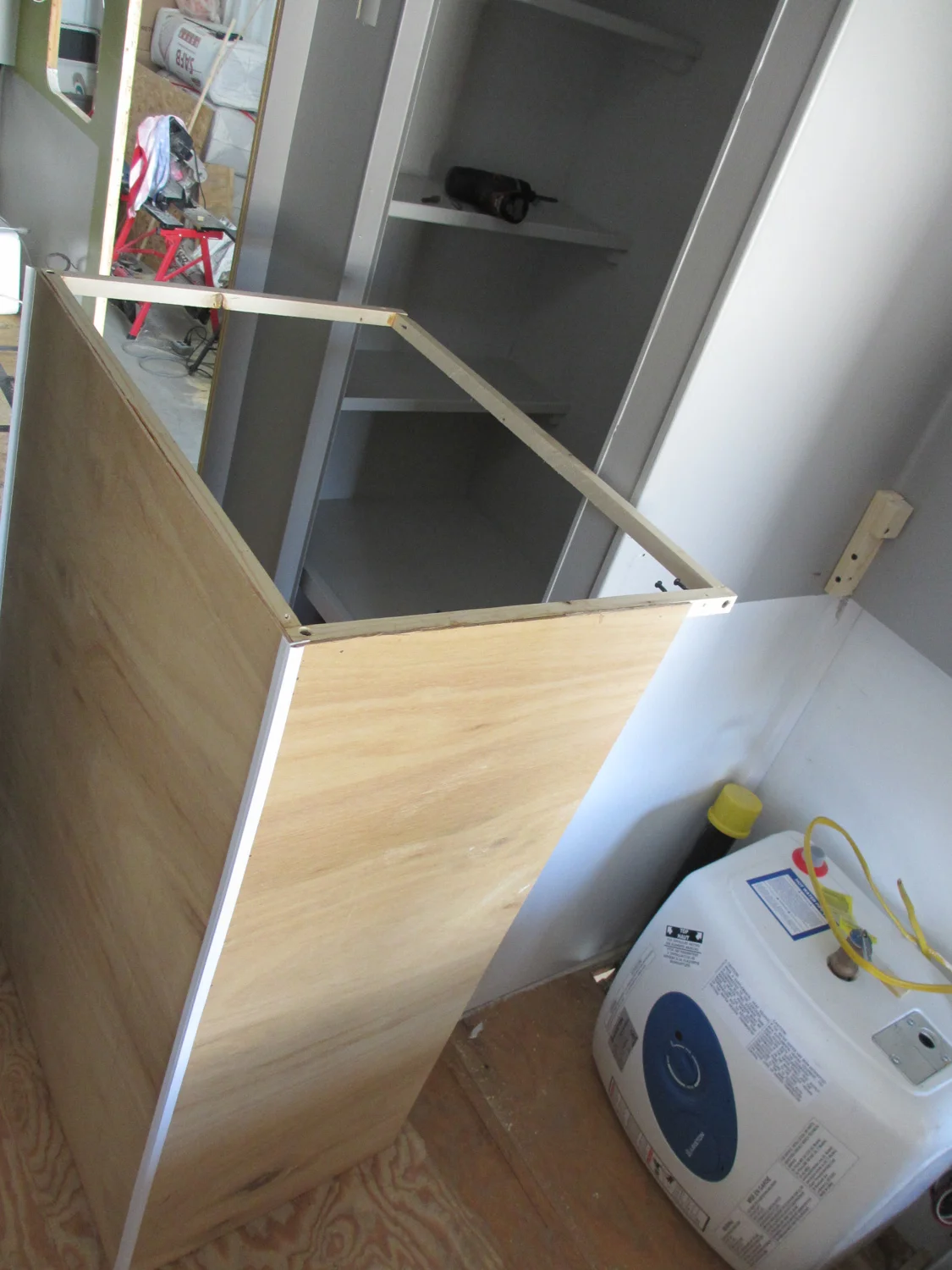 We have a mini hot water heater for the bathroom/shower and a separate one for the kitchen.