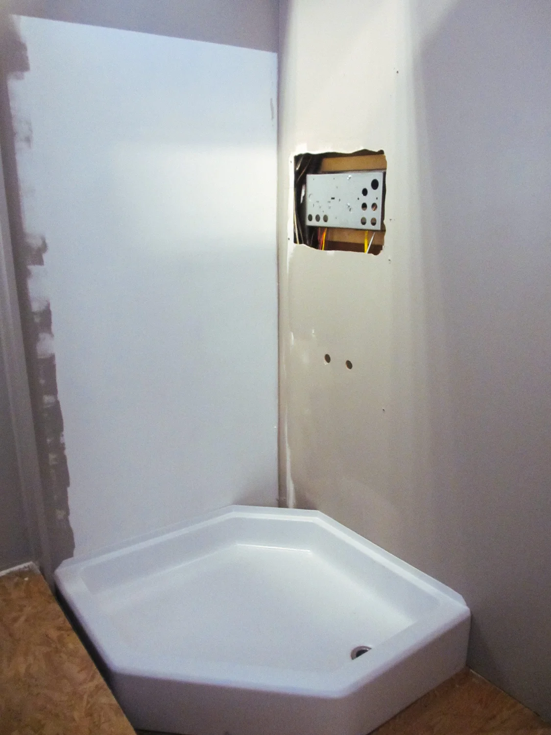 The rig originally had an alcove shower. We converted it to a neo-hex corner shower.