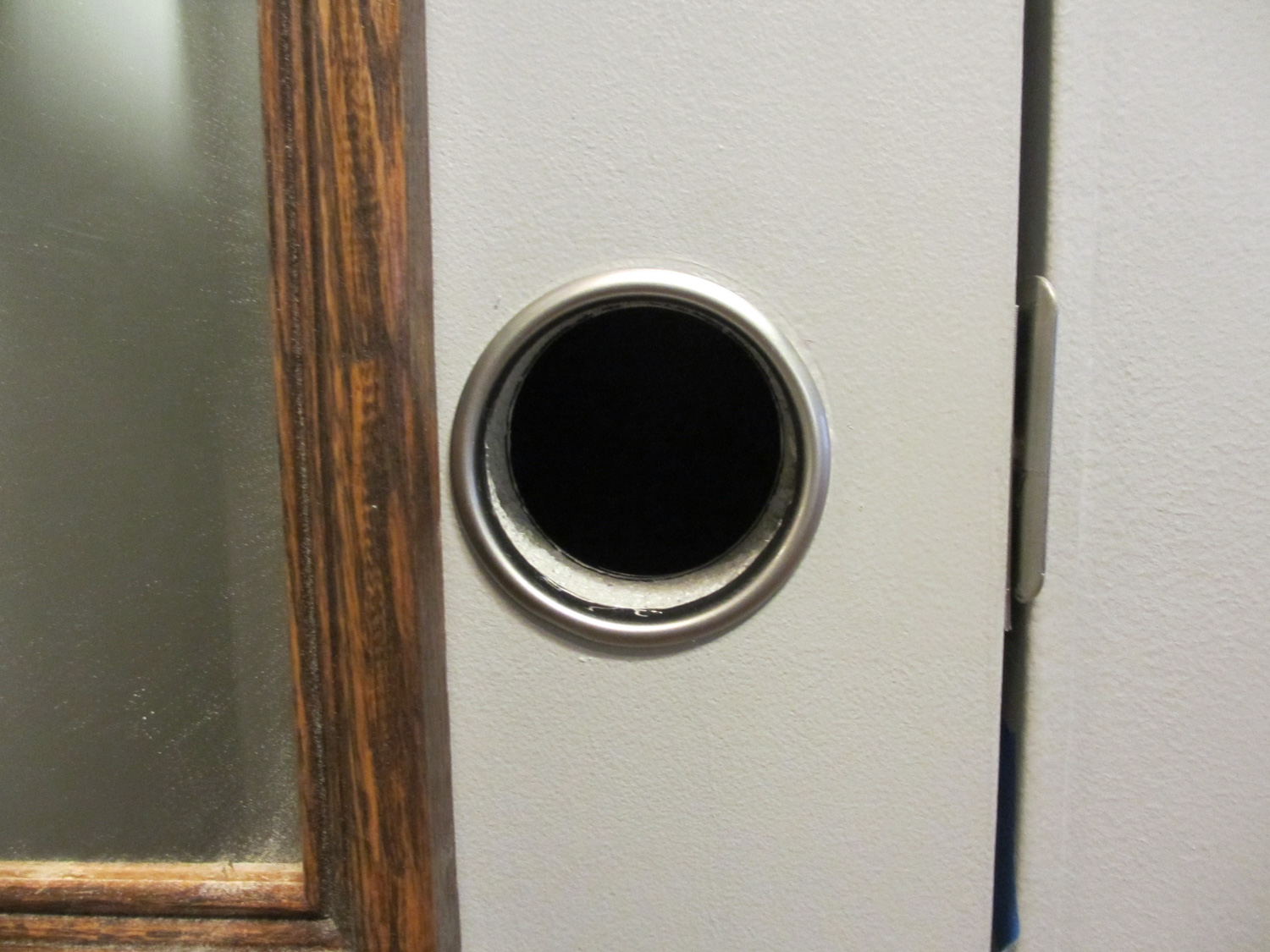  We decided to not install a standard doorknob on our closet door. Instead we have a "finger hole". This opens up the space in the hallway. 