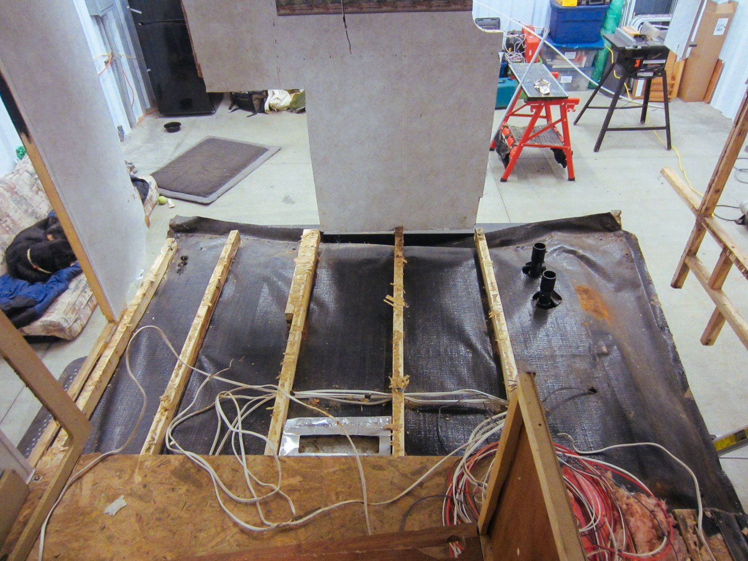  The kitchen sub-floor had to be ripped out due to water damage. 