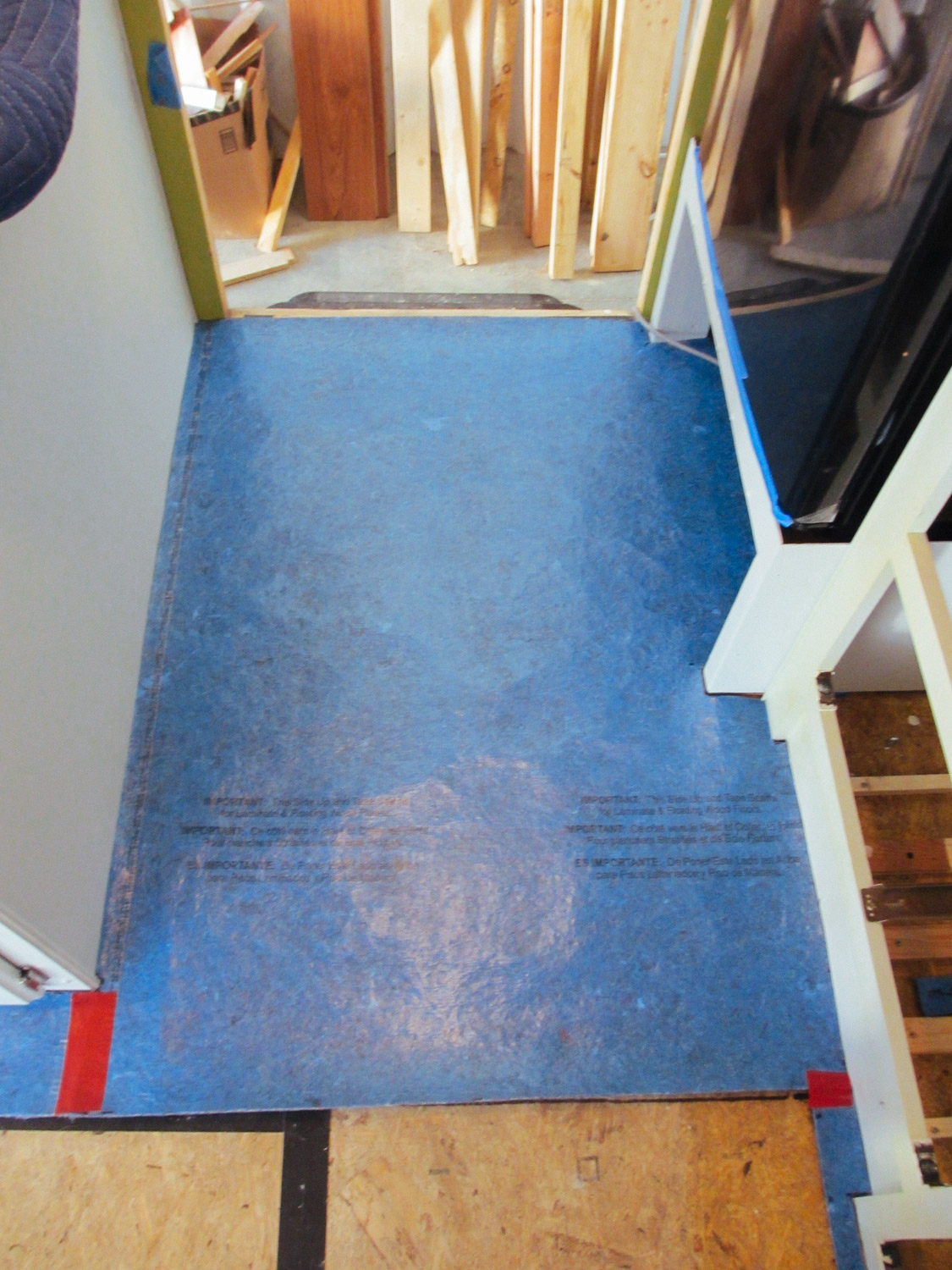  Underlayment was placed on top of the subfloor in preparation for the laminate floor. 