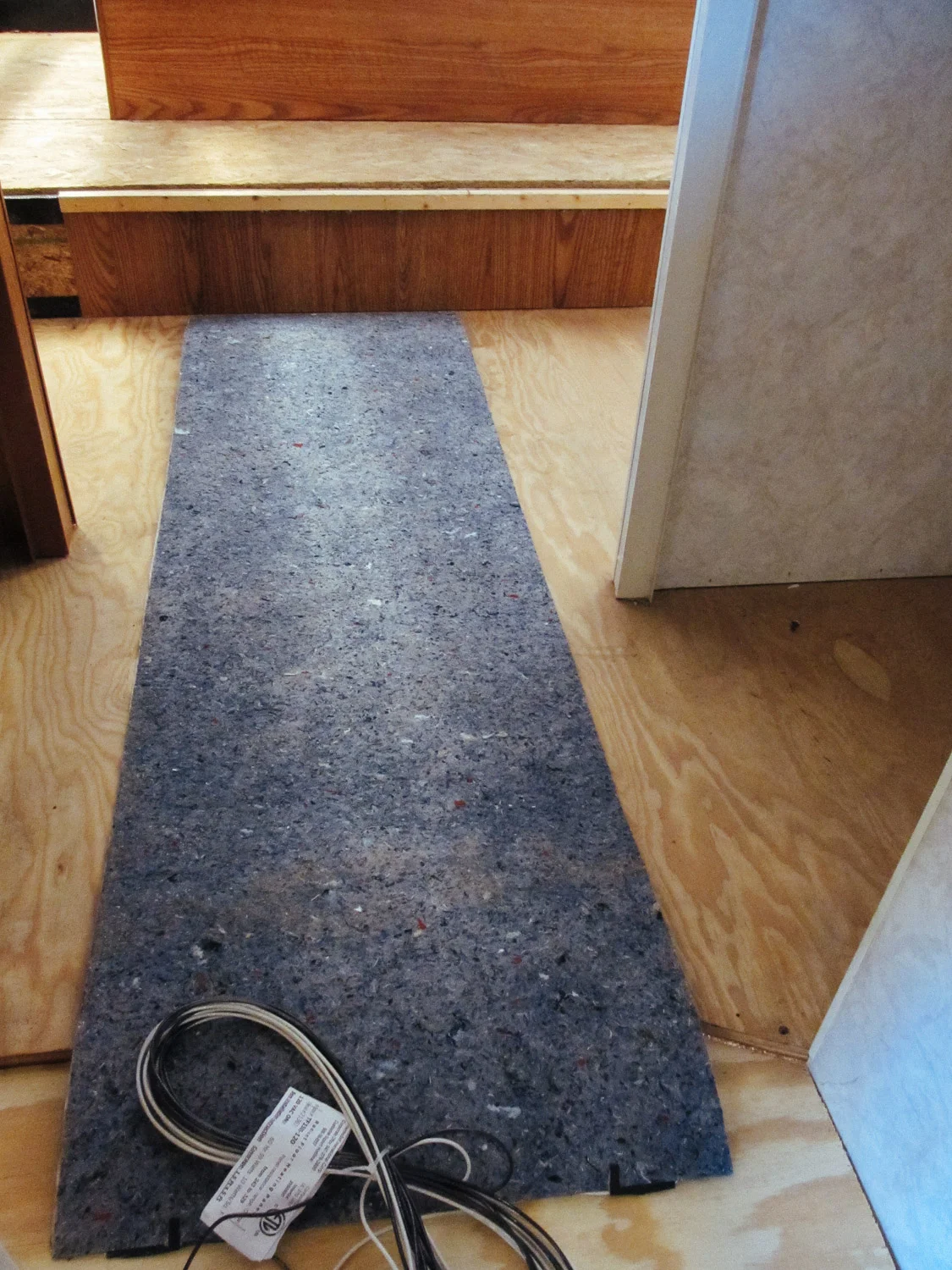 We had to extend the floor in the bedroom/bathroom hallway so it could fit a 5 ft. long piece of floor heating pad.