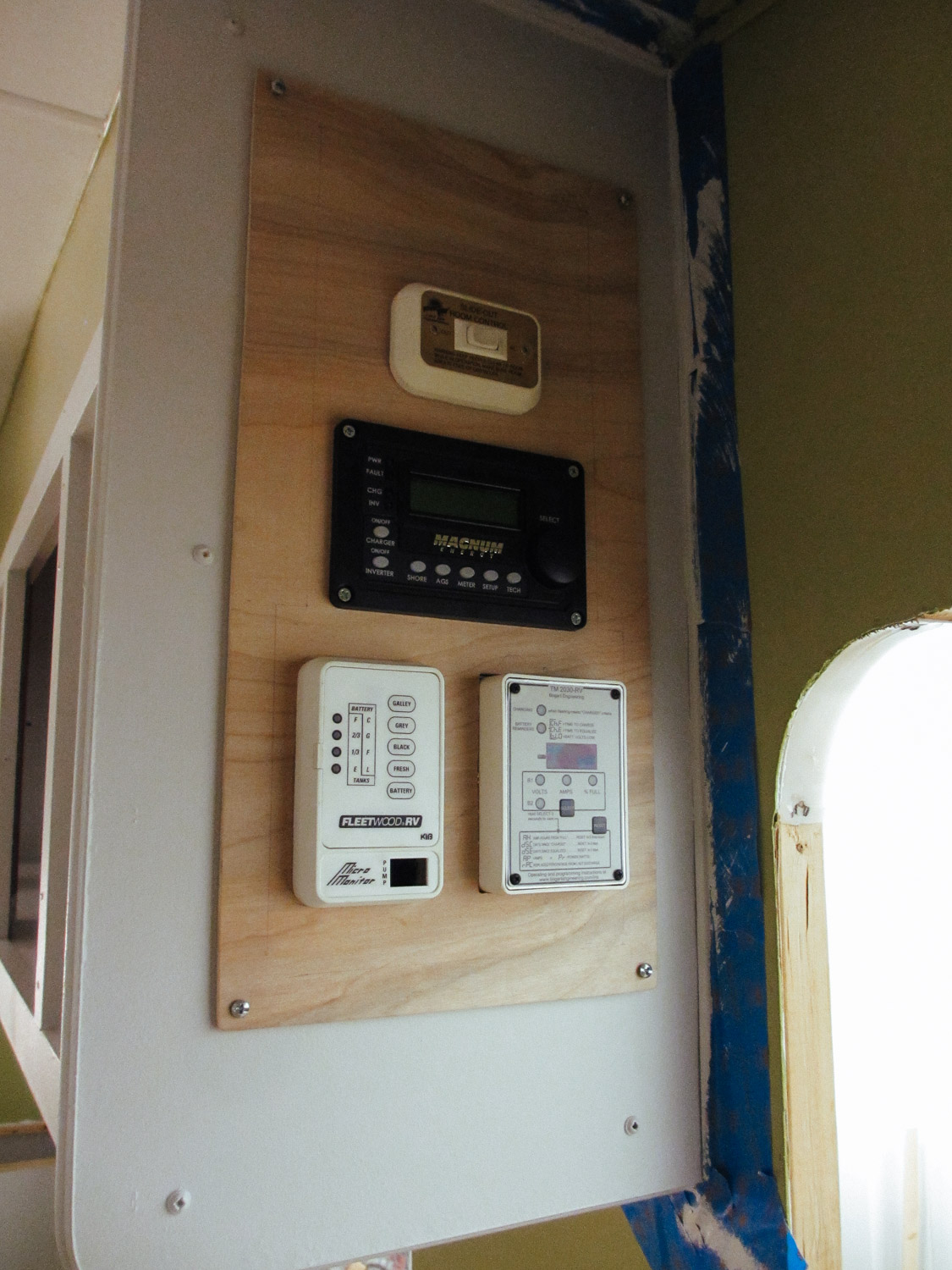  Our first version of our control panel included (top to bottom): slide control, inverter control, tank level sensors (left), and Trimetric battery monitor. 