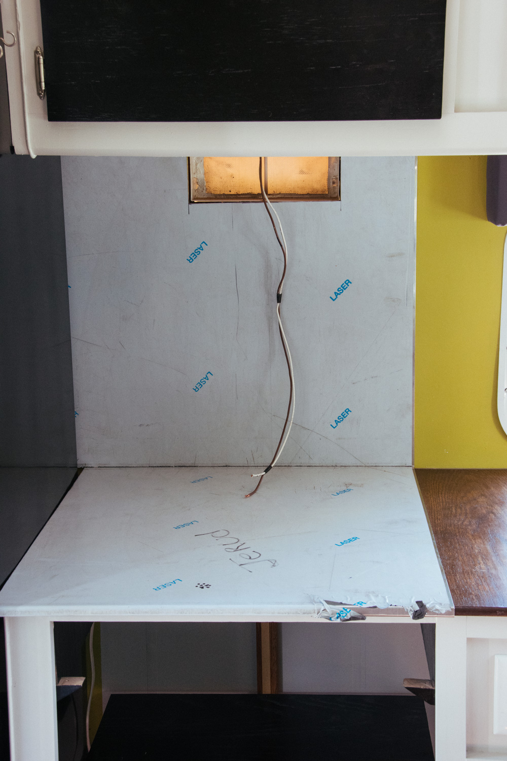  Test fitting the stainless steel counter and backsplash that we had fabricated by a local (Missoula) shop. 