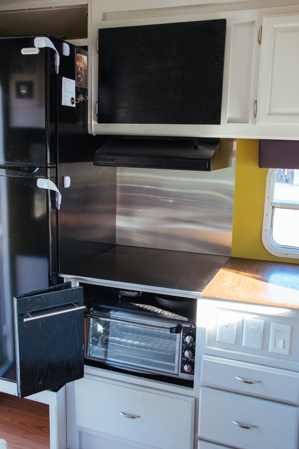  Our new kitchen! The induction cooktop is stored in the shelf above the toaster oven. 