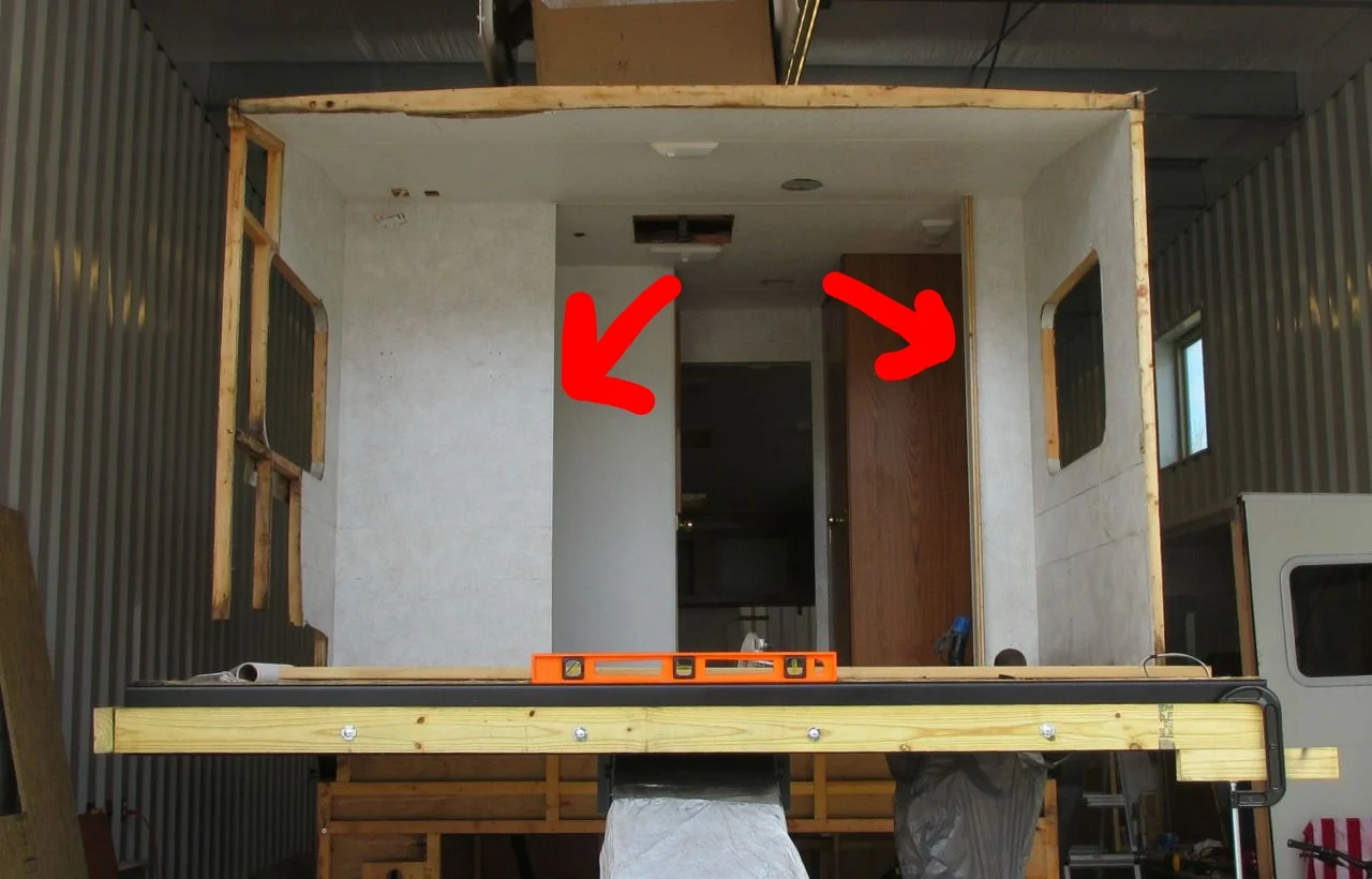Before: See the two wall the arrows are pointing at? The walls "separated" the bedroom from the shower (on the left) and bathroom sink (on the right).