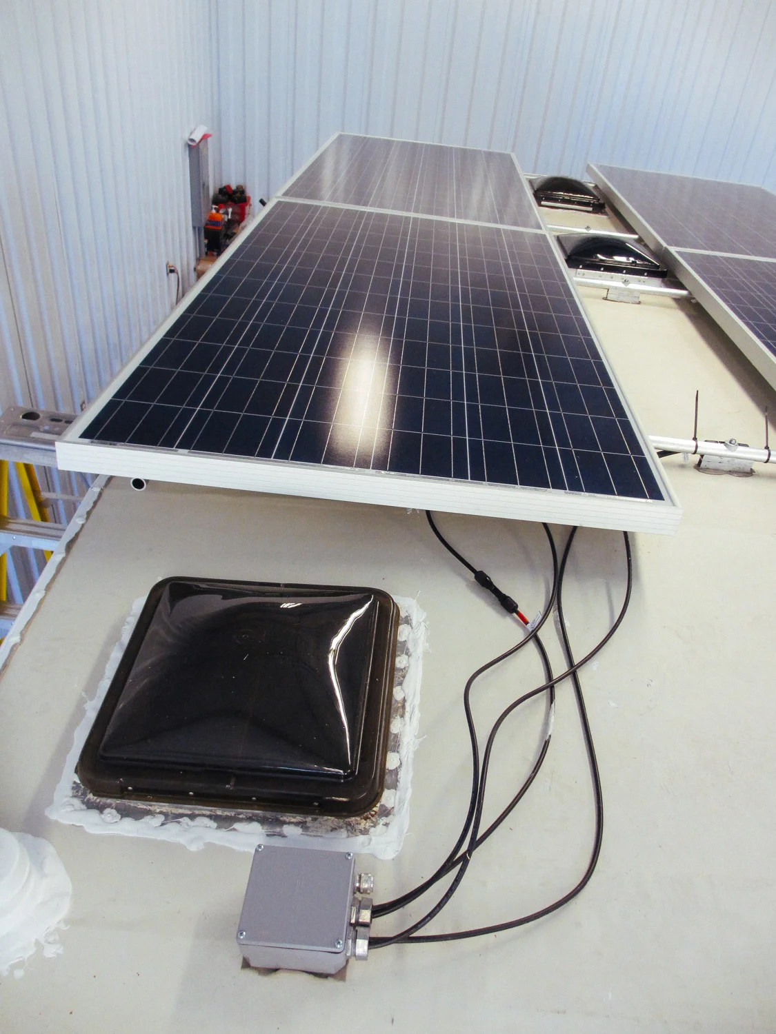 Solar panel leads going through the roof.