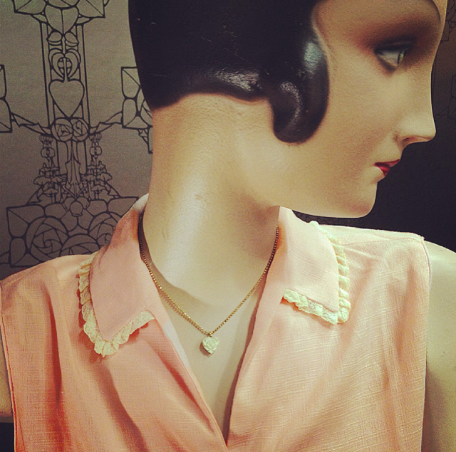 Marta wears a lovely vintage button up blouse with lace detail & tiny heart pendant.
