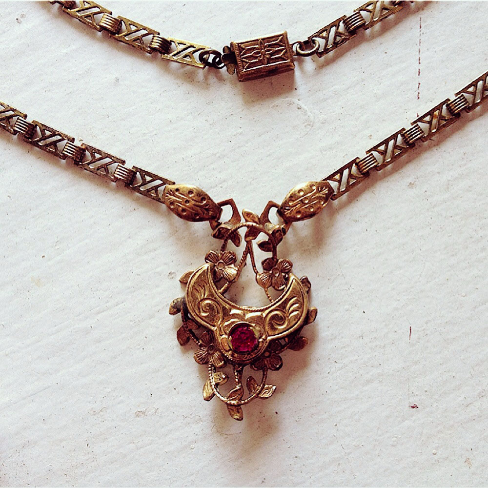 I assembled this pendant out of reincarnated Victorian bits and pieces of book chain.