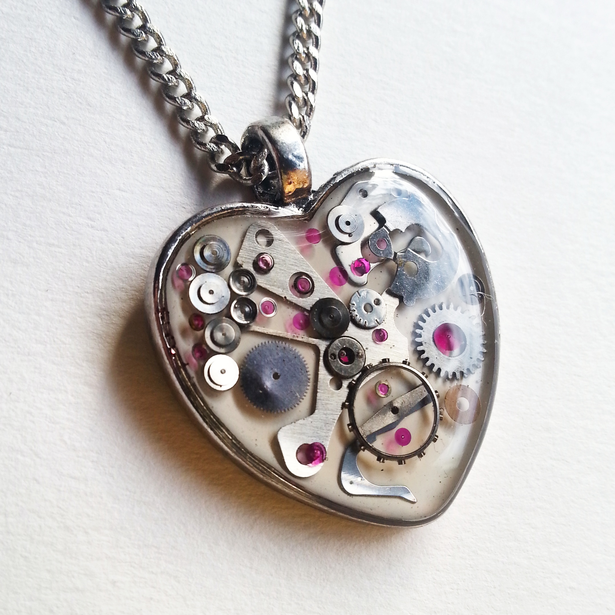 This snow white Mechanical Heart contains lots of pink jewels!