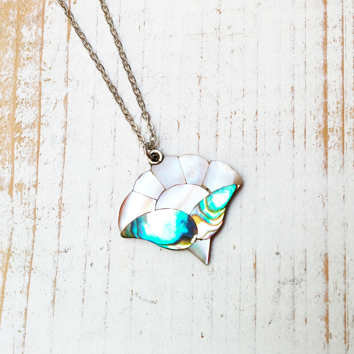 Also available at Arts Market, this beautiful abalone flower/sunrise pendant