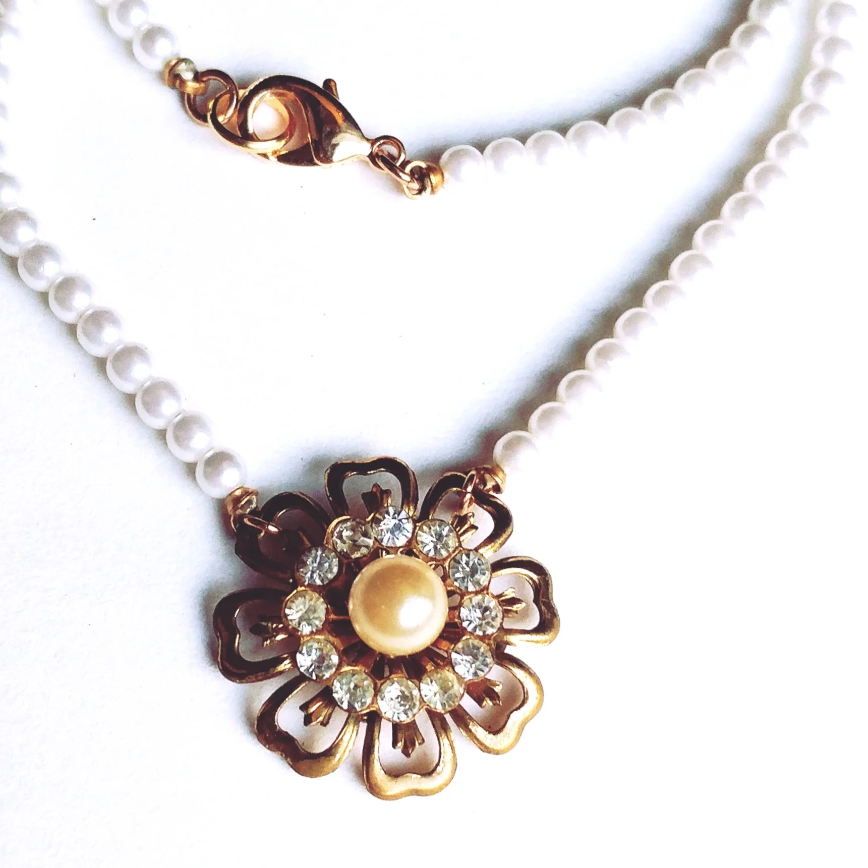 pearl necklace with vintage pendant created from a former brooch