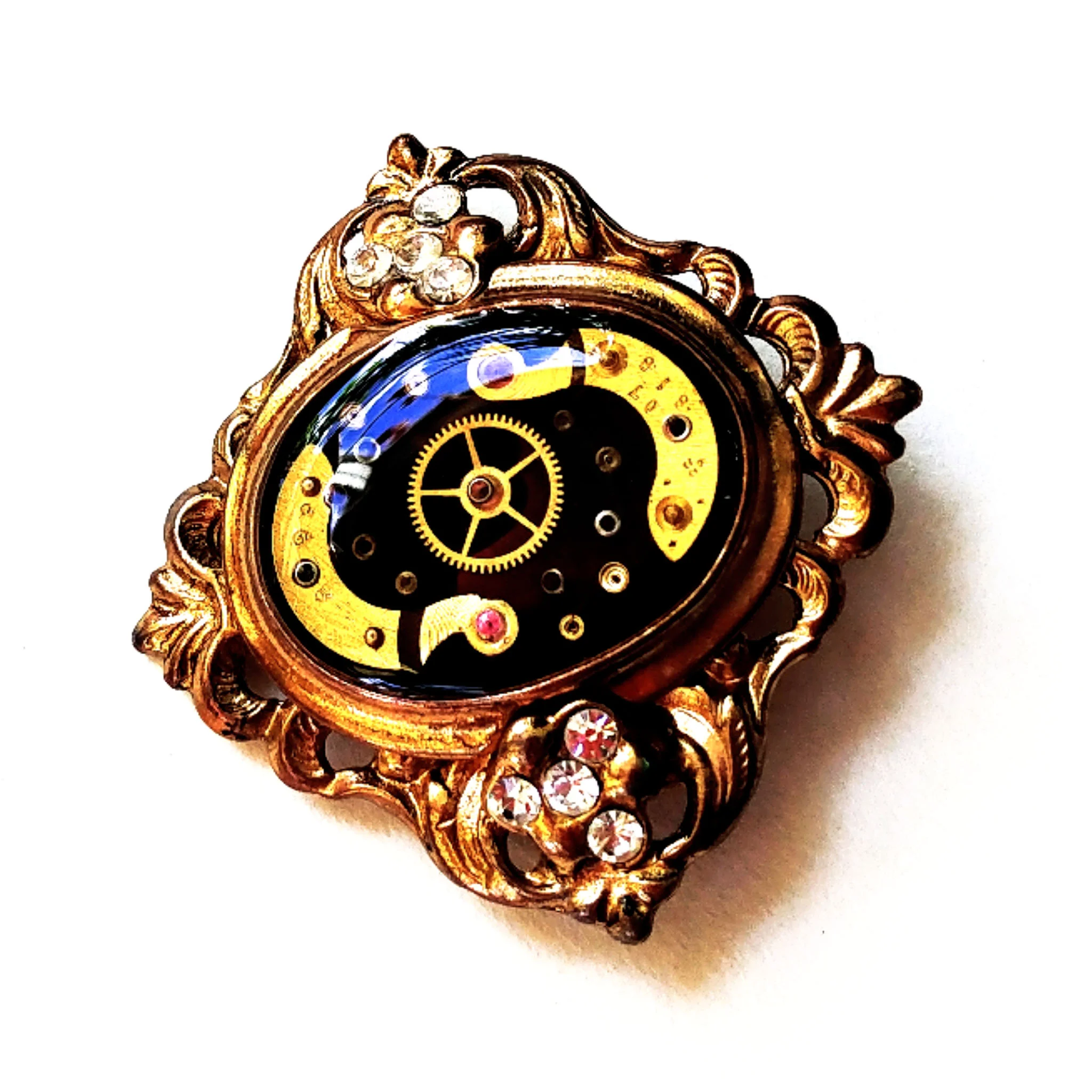 Multiple layers of antique watch parts set in place of the stone I removed from an upcycled brooch! A unique one of a kind piece - roughly 2 1/4” wide.