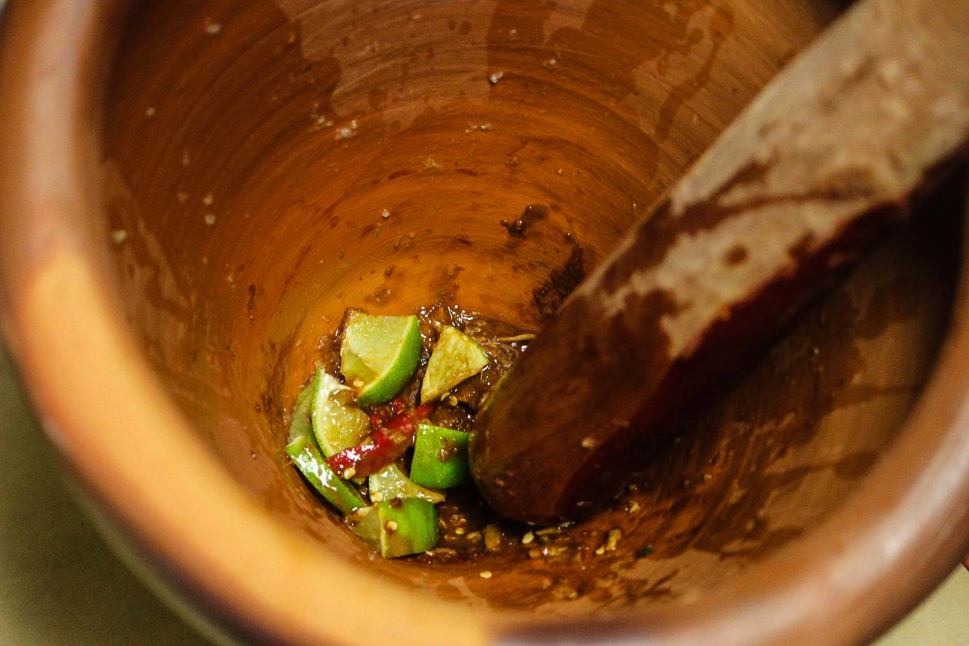 My Pirate uses our new Thai clay mortar and wood pestle to mix up fantastic salad dressings. 