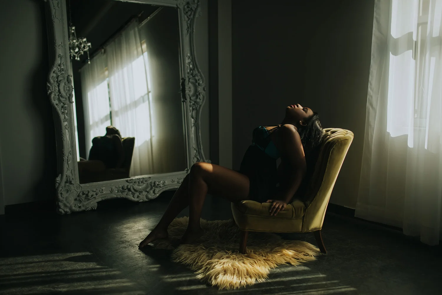 Boudoir post on chair with mirror in background