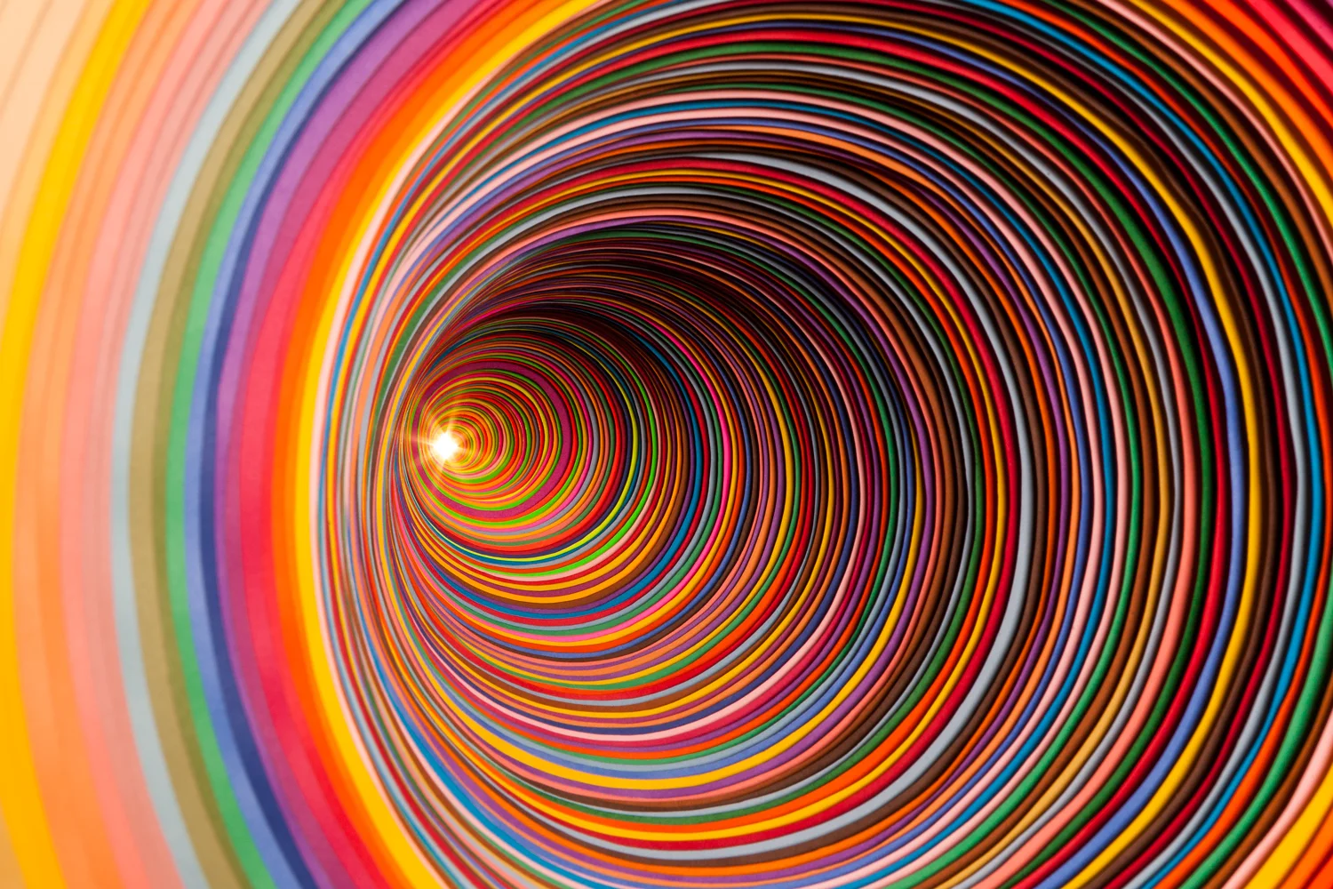 Jen Stark , Piece of an Infinite Whole (installation in a wall, detail), backlit hand-cut paper, 24 x 24 x 48 inches, 2007