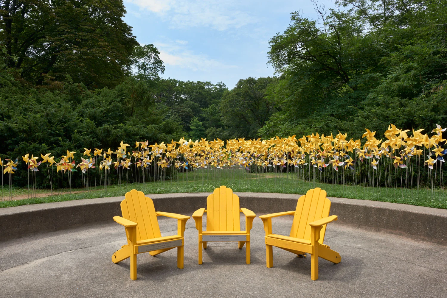 Three Adirondack chairs at the Connective Project in Prospect Park, Brooklyn. Image © harlan erskine