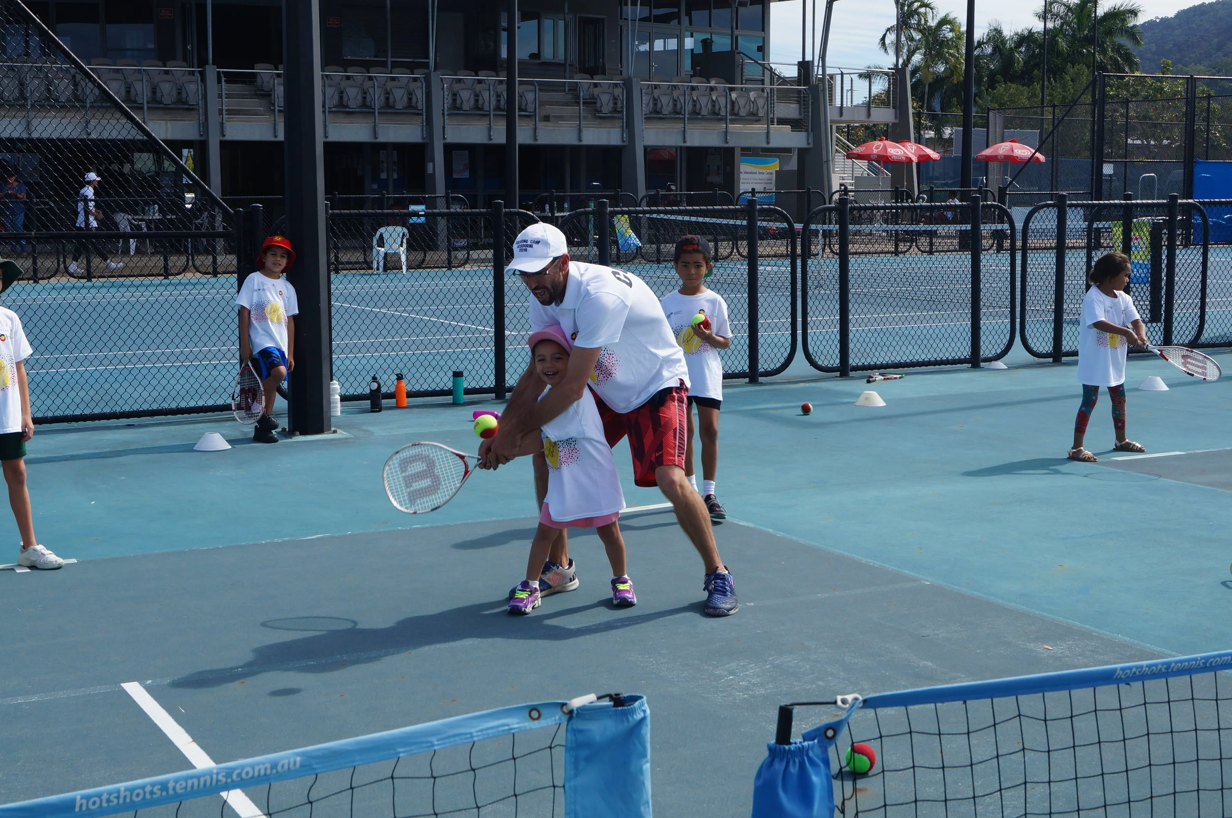 Happy Hotshot kids enjoy learning with Coach Jarred