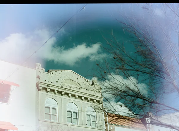 a bright and sunny row of buildings in downtown savannah, snapped through my sunglasses while we were eating lunch.