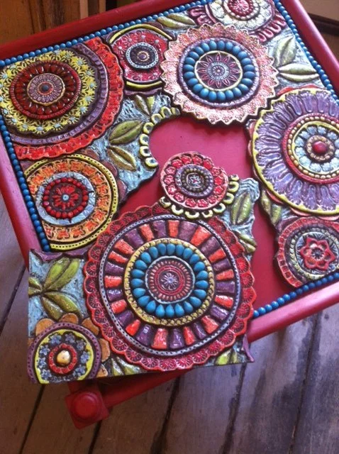 Setting the tiles into our great find - the vintage red table.