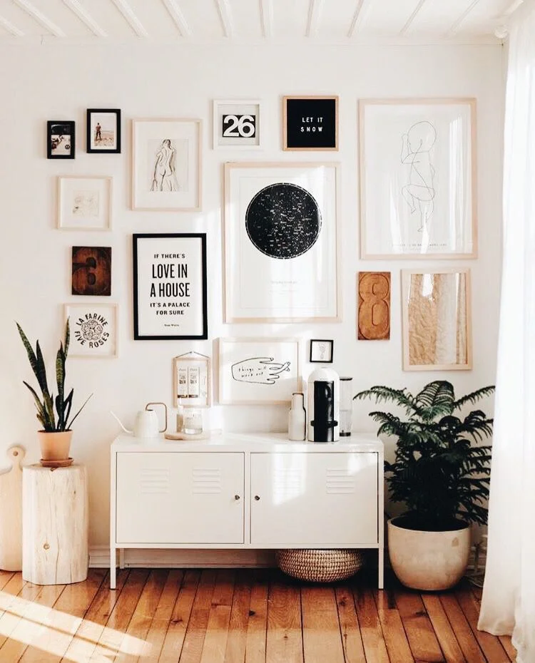 A tall gallery wall will lead the eye upwards via Pinterest
