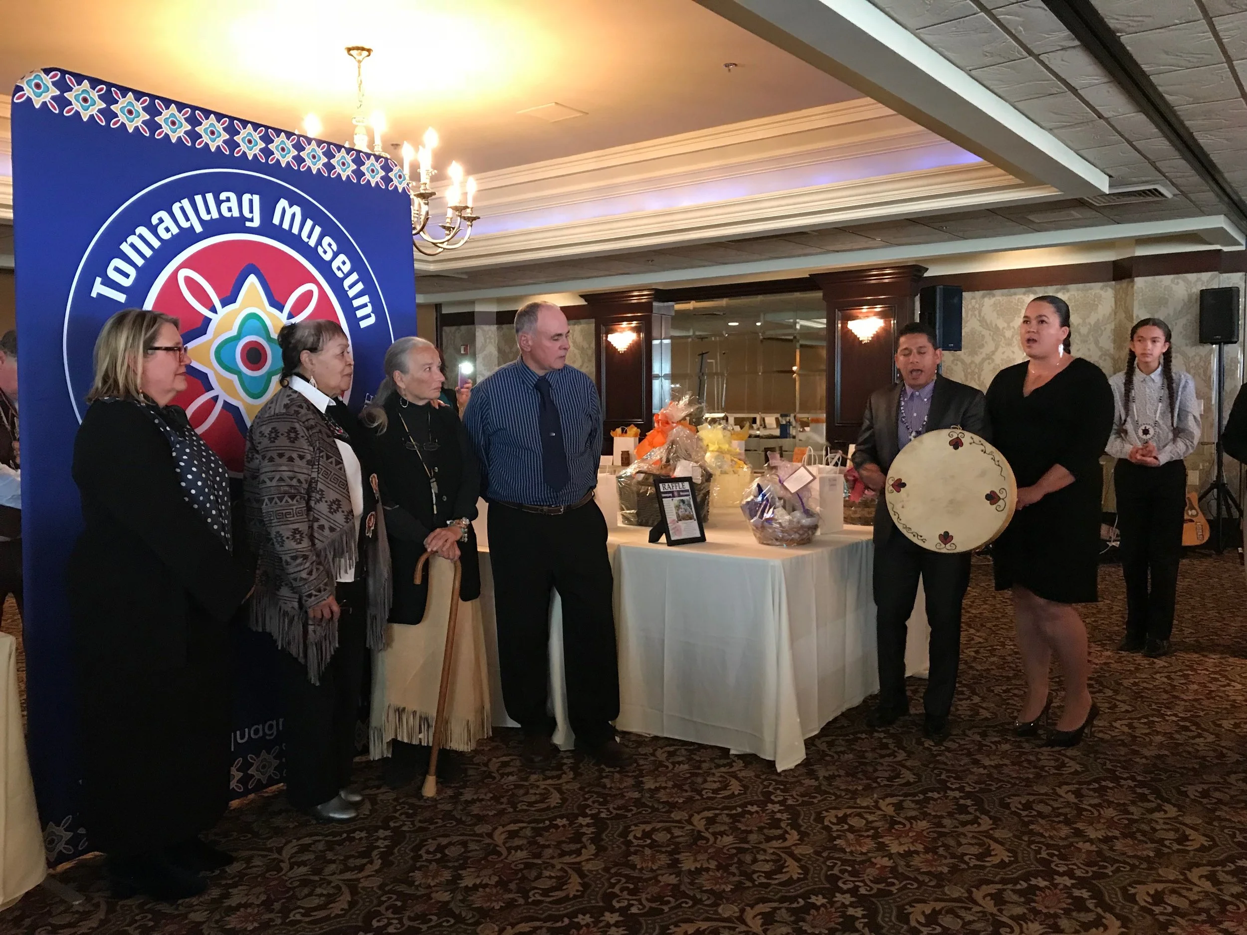 Awardees receiving an honor song by community members Thawn & Eleanor Harris