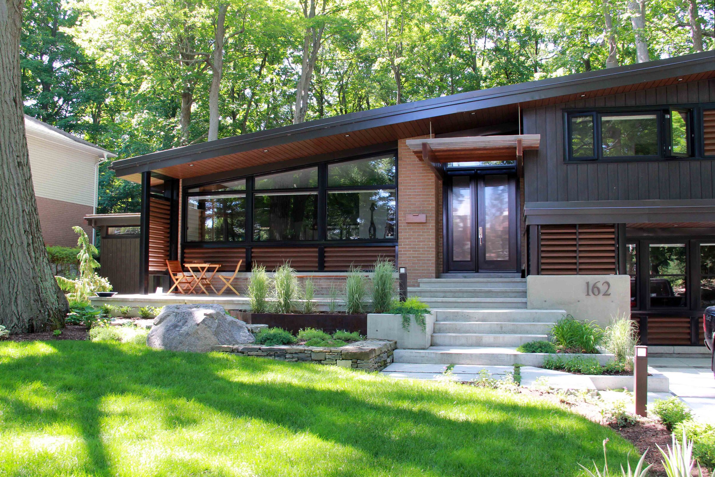 Front of Home-Grass space-Front Yard-Mid-Century Modern-Natural Stone-Wood and Conrete-Privacy screen-wood features-Terrace.jpg