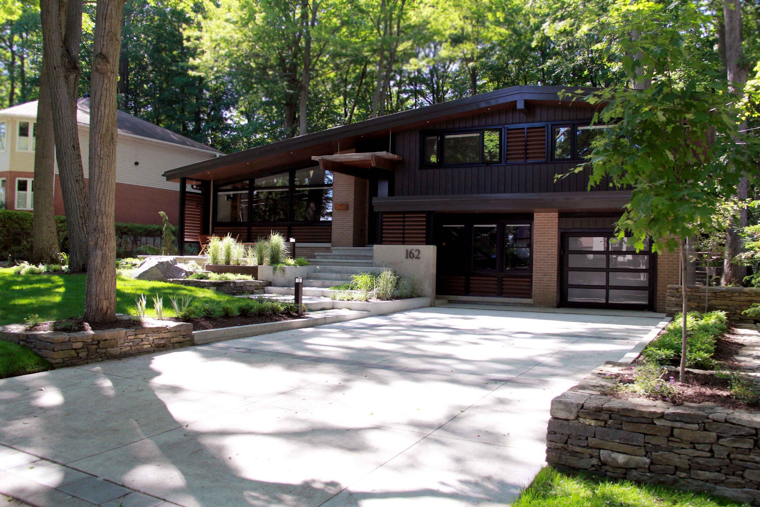 Mid-Century modern Home-Driveway- Modern Elements- Raised Gardens- Poured conrete- Landscape design- Landscape features.jpg