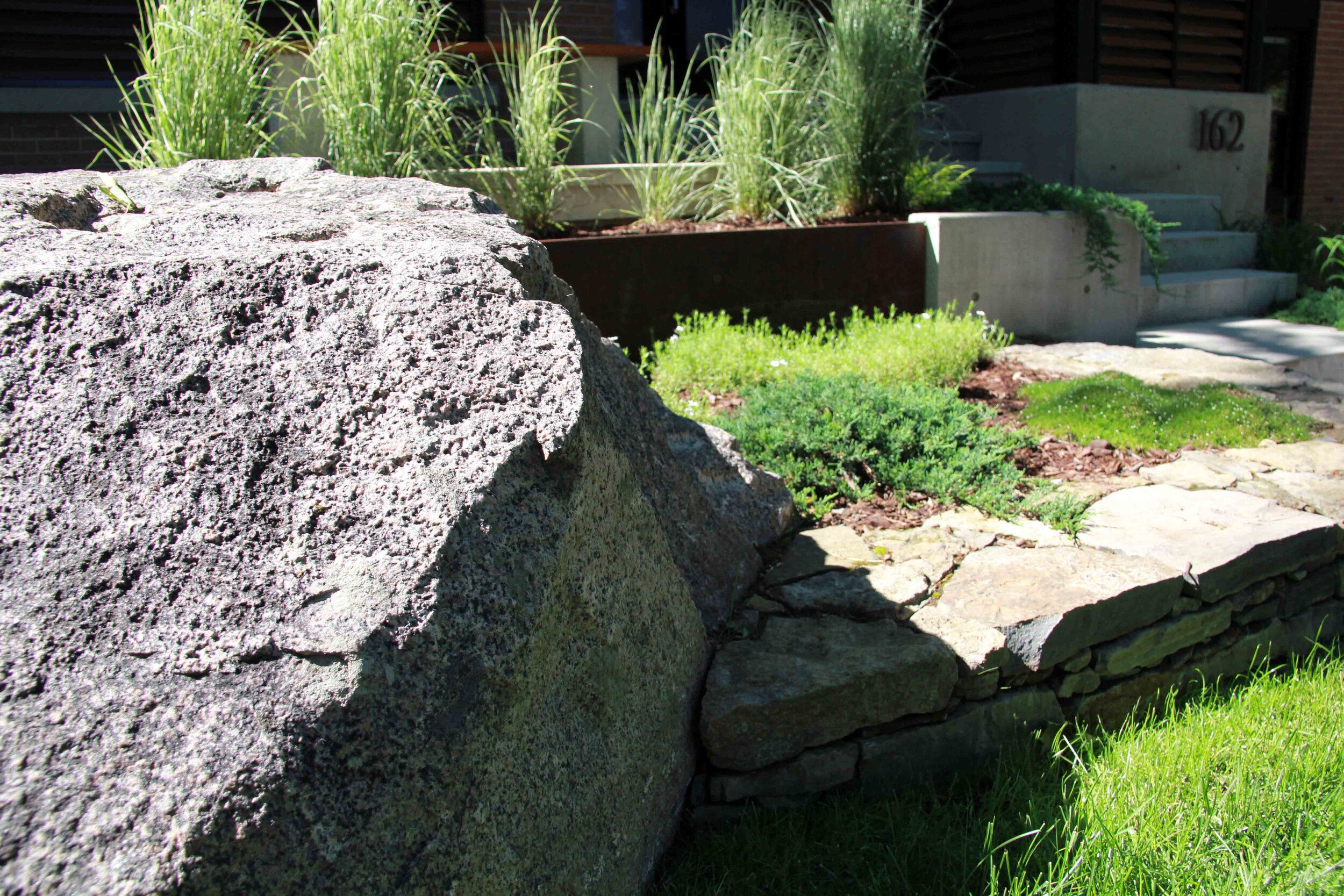 Natural Stone-Granite-Ground cover- Perennials- Natural stone wall- Garden beds- perennial grasses.jpg