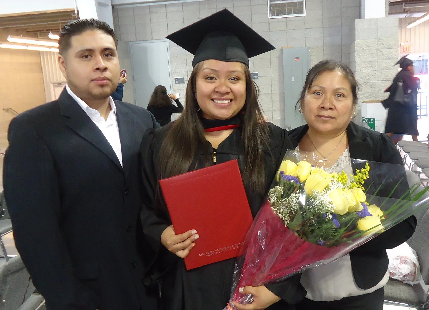 Sonia at her college graduation this June - with her mother and brother. 